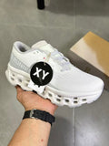 On Running Running Sneakers in White and Gray - product image from the listing.