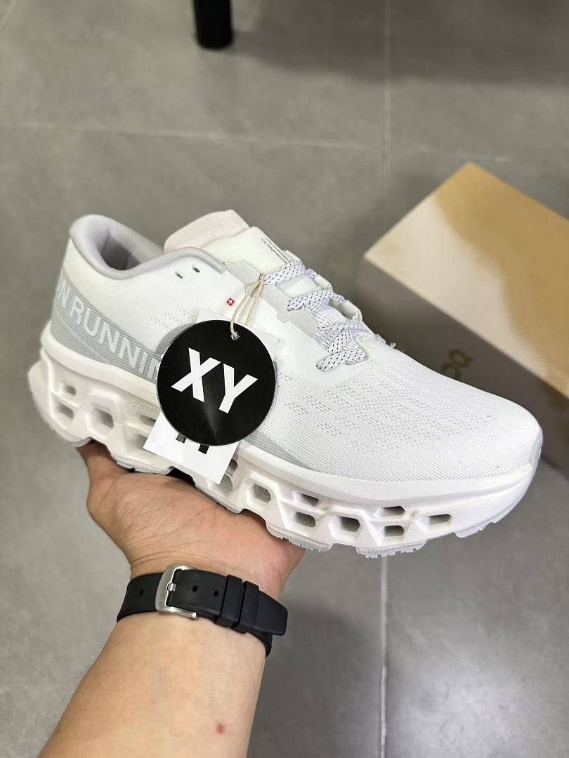 On Running Running Sneakers in White and Gray - product image from the listing.