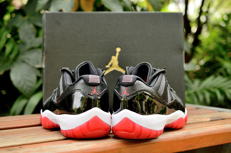 Air Jordan 11 Retro Low Black and Red Sneakers - product image from the listing.