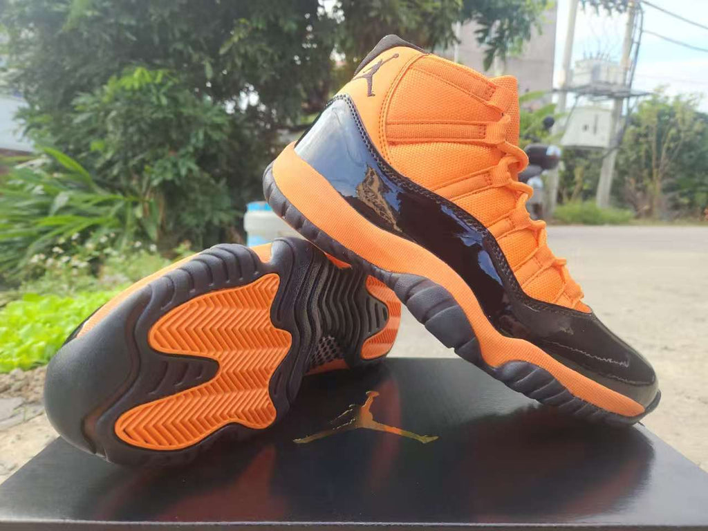 "Black/Orange" Air Jordan 11 Retro Sneaker - product image from the listing.