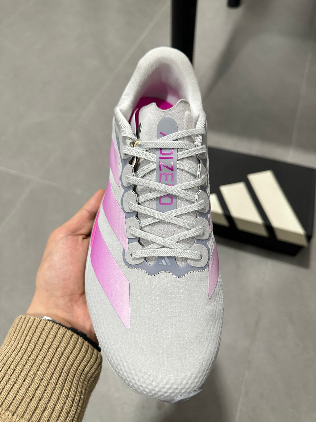 adidas Adizero Lightstrike Pro Running Shoes, in Gray and Pink - product image from the listing.
