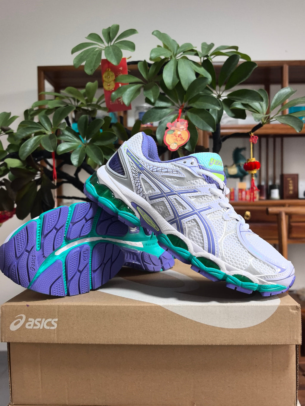 Blue and Purple ASICS GEL-NIMBUS 16 Sneakers - product image from the listing.