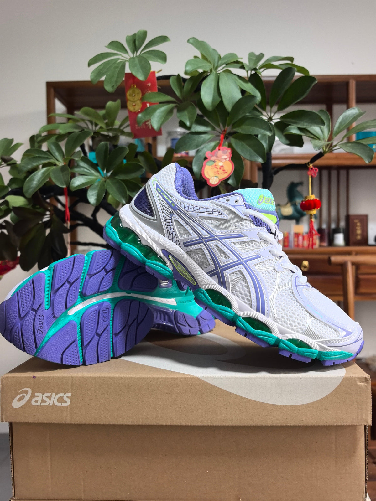 Blue and Purple ASICS GEL-NIMBUS 16 Sneakers - product image from the listing.
