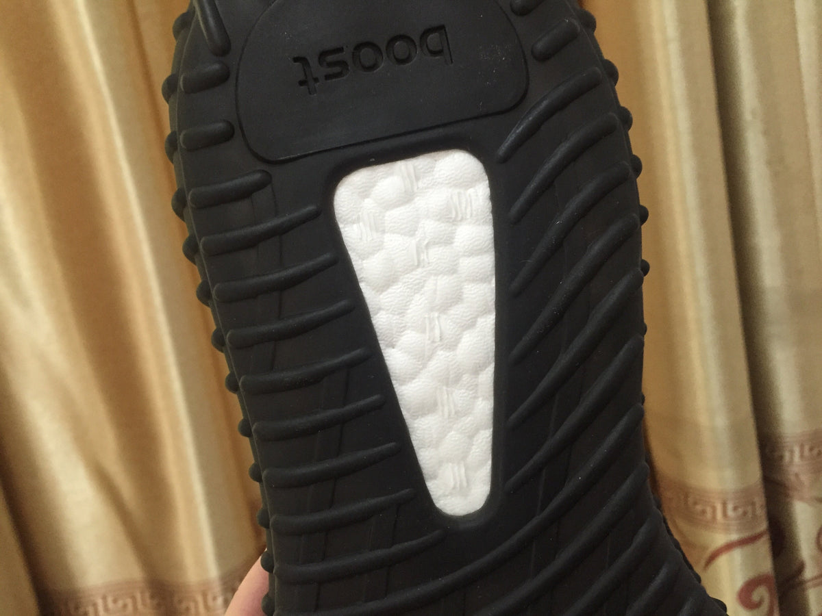 Yeezy 350 V2 Sneakers in Black and Red Knit - product image from the listing.