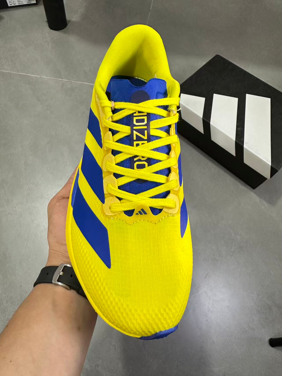 Adidas Lightstrike Pro Running Shoes, in Yellow and Blue - product image from the listing.