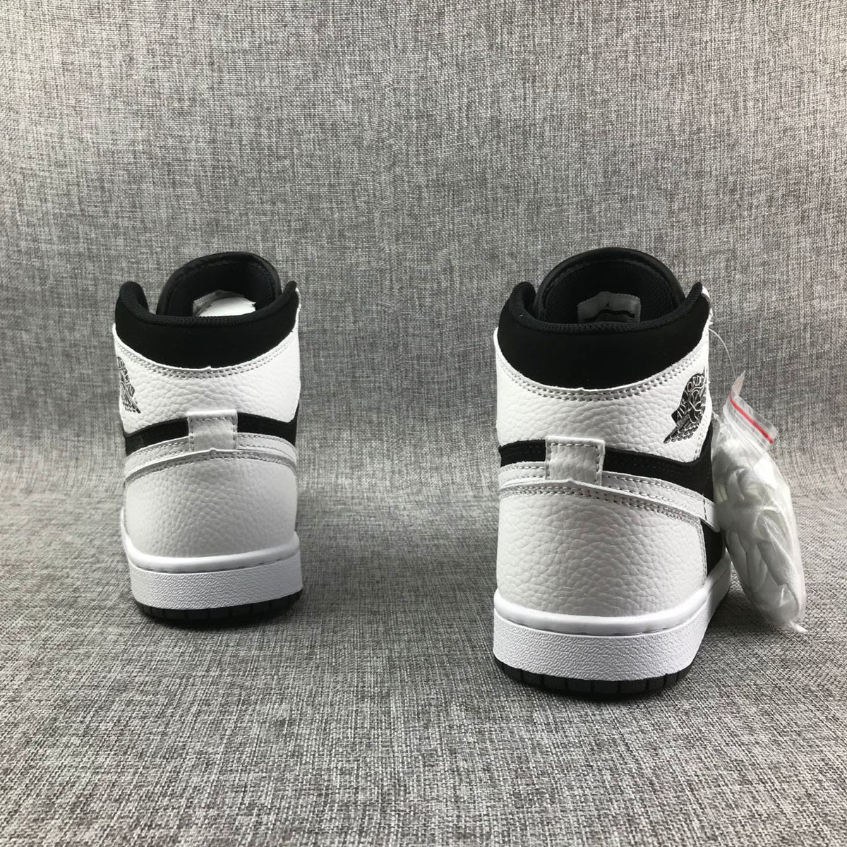 Air Jordan 1 High Sneakers in Black and White 554724-113 - product image from the listing.