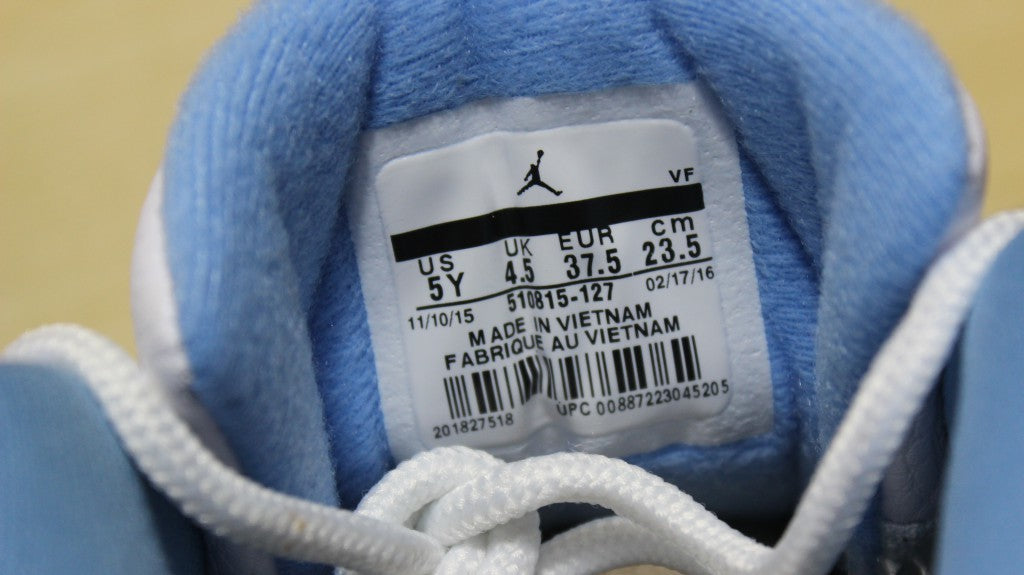 Air Jordan 12 High-Top Sneakers in University Blue 510815-127 - product image from the listing.