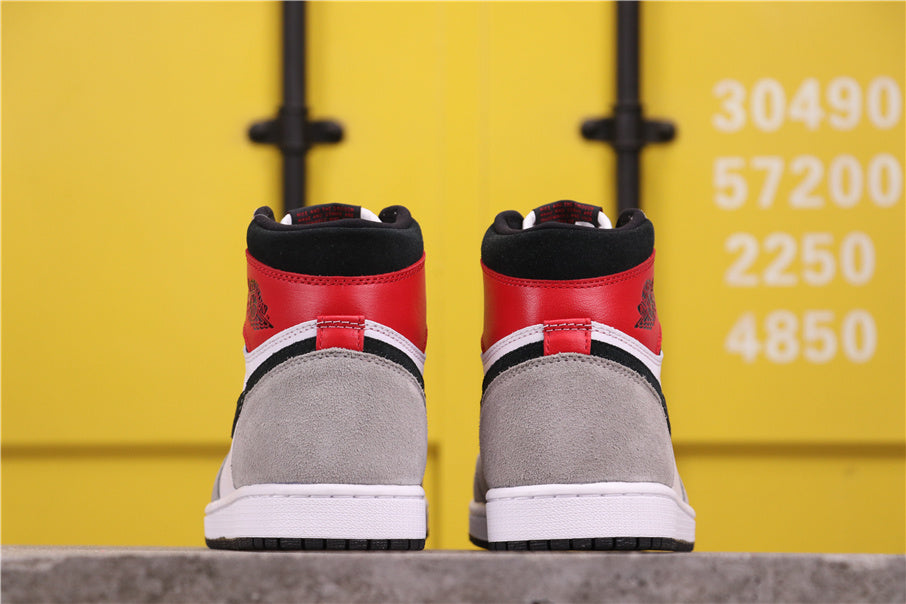 Air Jordan 1 High Sneakers in Light Smoke Grey 555088-126 - product image from the listing.