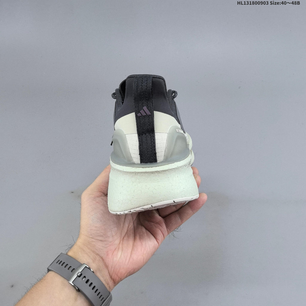Adidas Ultraboost 5 Running Shoes, in Charcoal and Cream - product image from the listing.