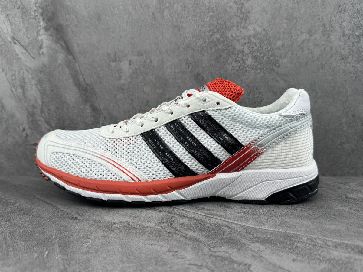 Adidas White Mesh Trainers with Black Stripes and Coral Accents - product image from the listing.