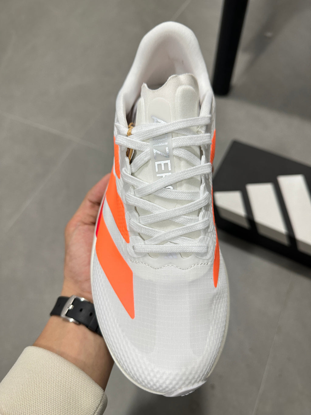 Adidas Adizero EVO SL Running Shoes in White Orange - product image from the listing.