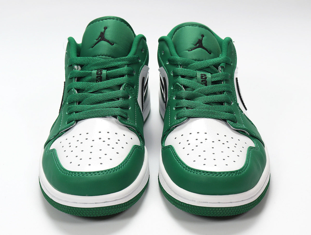 Jordan 1 Low Sneakers in White and Green 553558-301 - product image from the listing.
