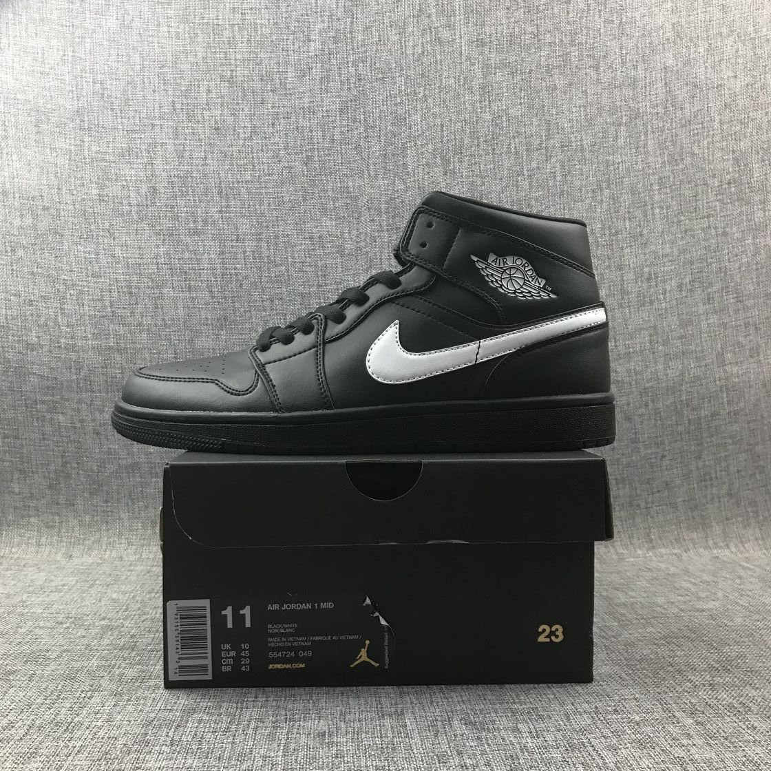 Air Jordan 1 Mid Sneakers in Black White 554724-049 - product image from the listing.
