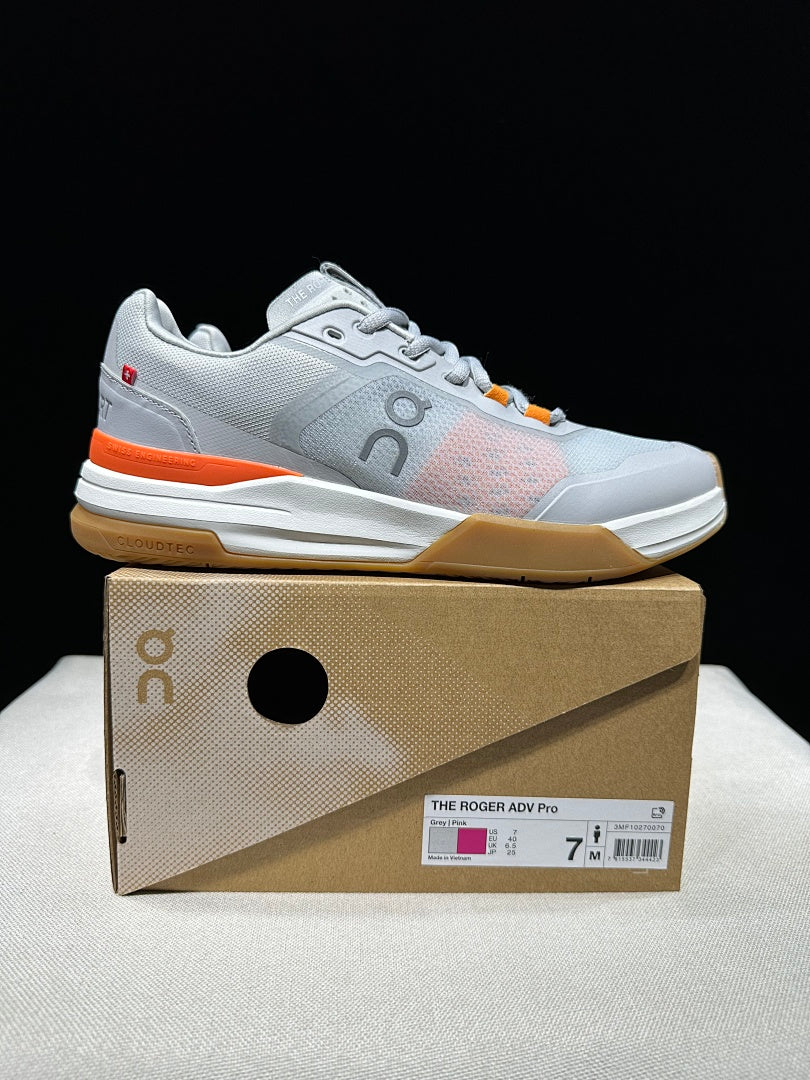 On THE ROGER Advantage Pro Tennis Shoes, in Grey and Orange - product image from the listing.