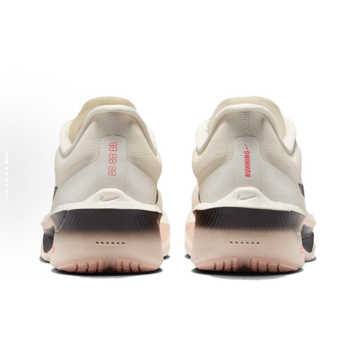 Light Beige and Black Nike ZoomX Running Shoes - product image from the listing.