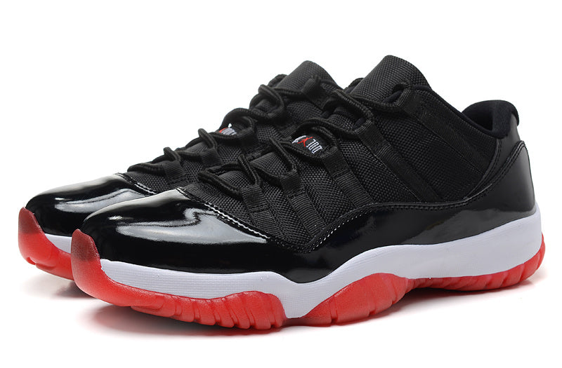 Air Jordan 11 Retro Low Black and Red Sneakers - product image from the listing.