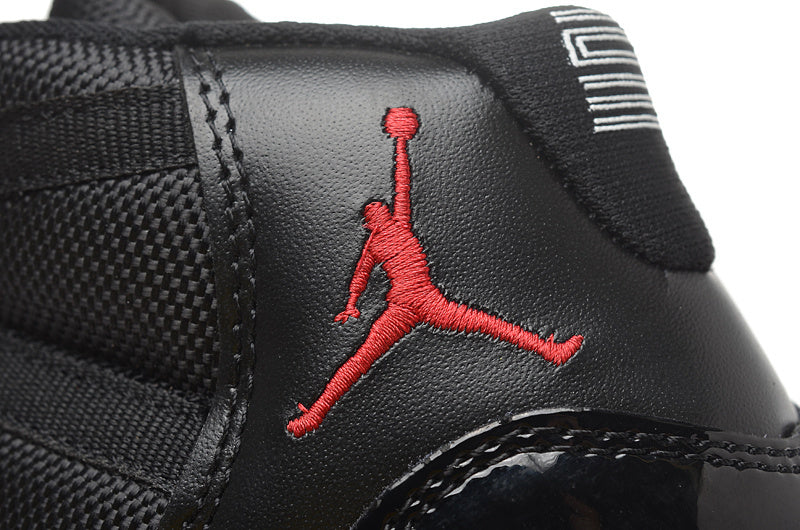 Air Jordan 11 Retro High Basketball Sneakers in Black Red - product image from the listing.