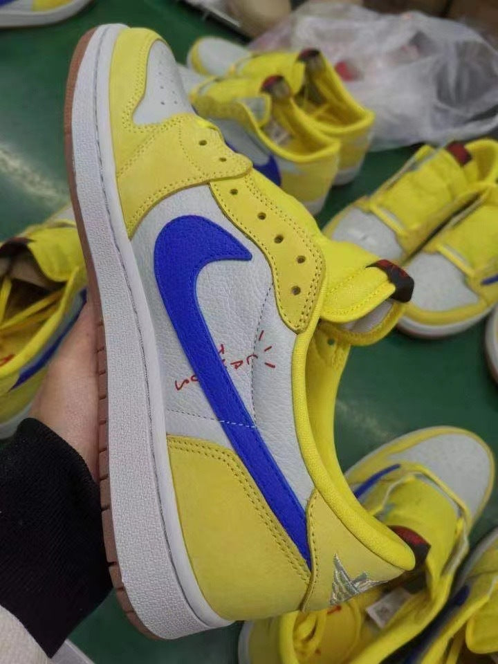 Jordan 1 Low Sneakers in Canary Yellow and Blue DZ4137-700 - product image from the listing.