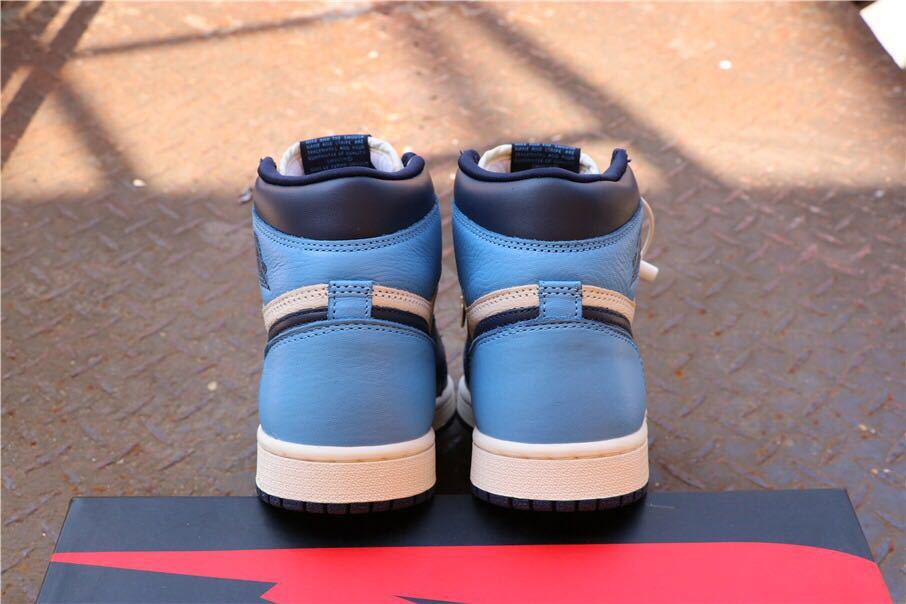 Air Jordan 1 Retro High OG Sneakers in Blue and White - product image from the listing.