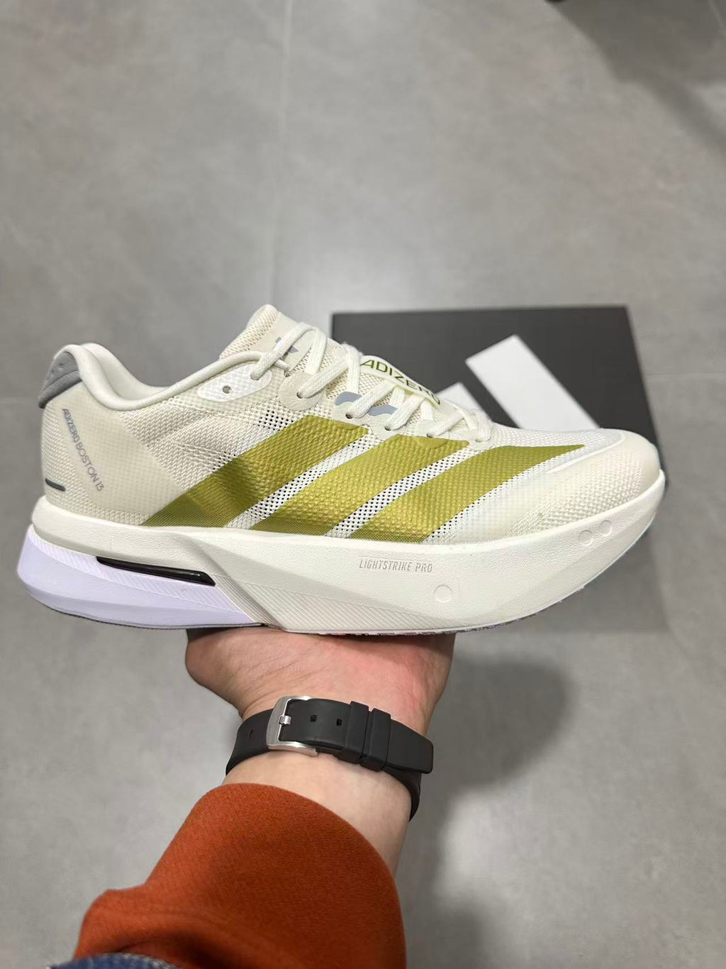 Adizero Lightstrike Pro Running Shoes in White and Olive JS4947 - product image from the listing.