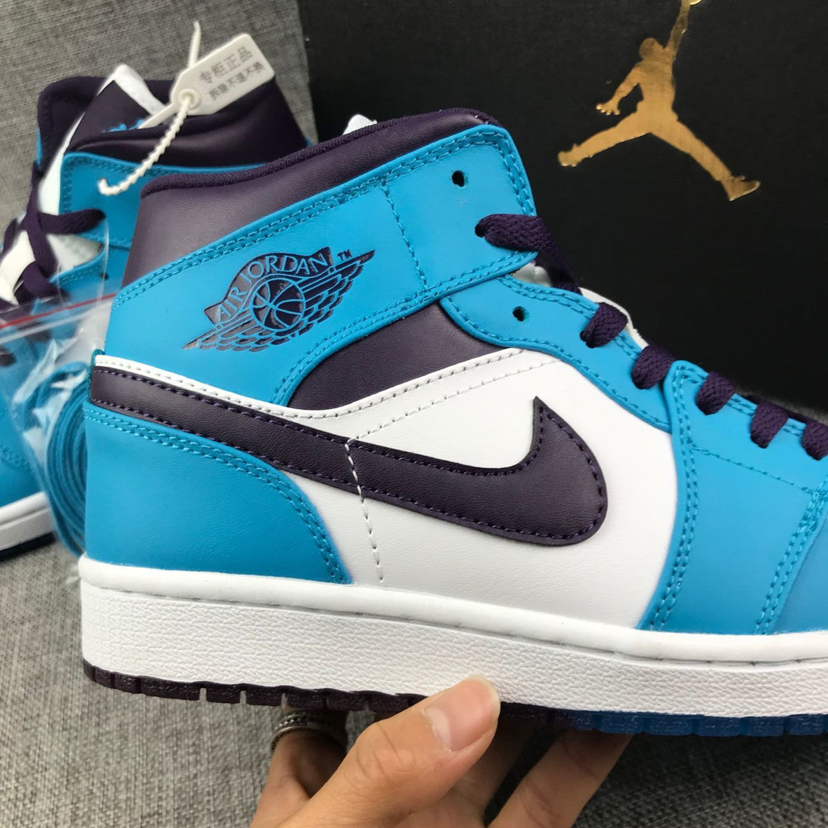 Air Jordan 1 Mid Sneakers in Blue, in White and Black - product image from the listing.