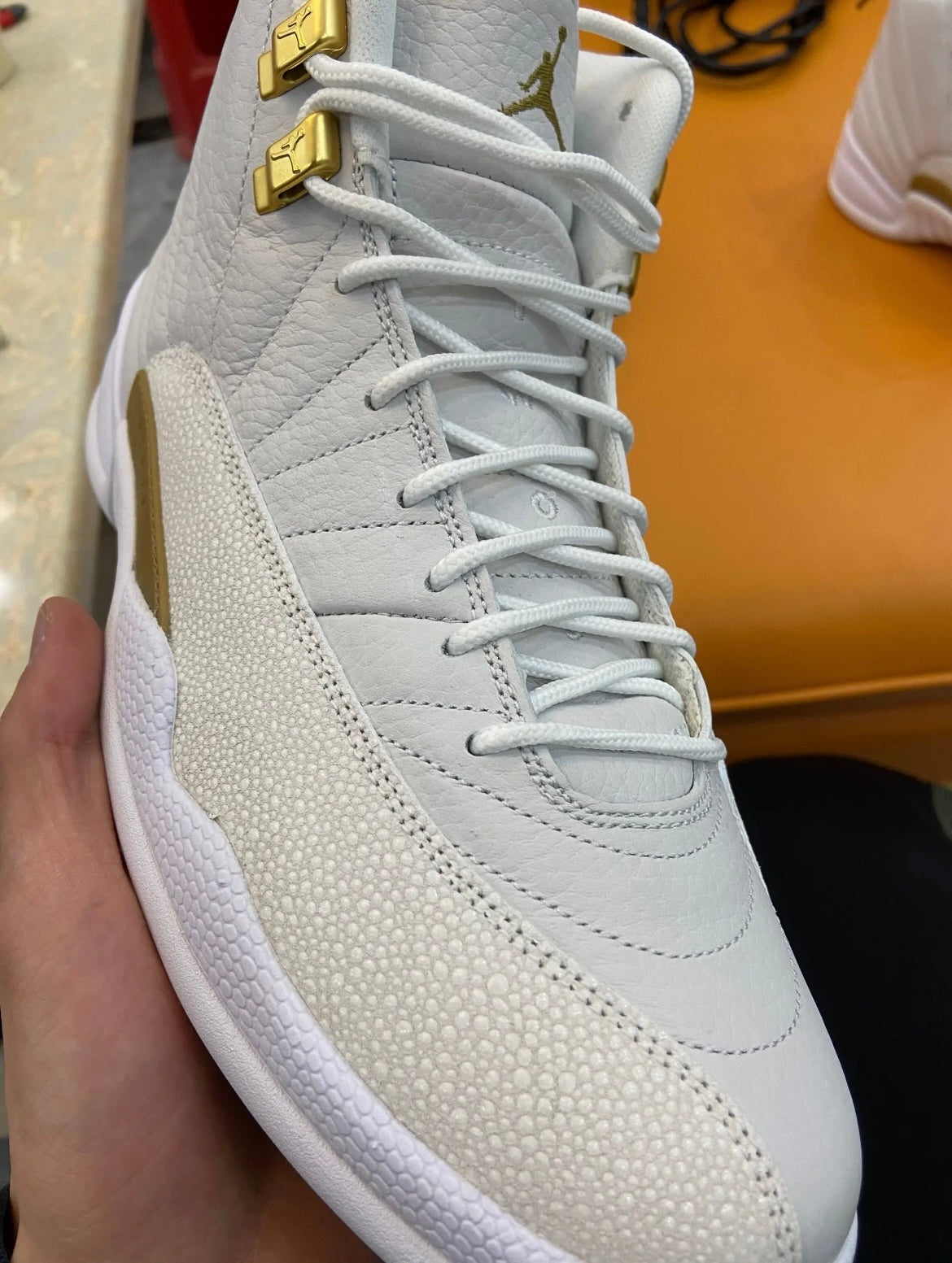Air Jordan 12 OVO Sneakers in White 873864-102 - product image from the listing.