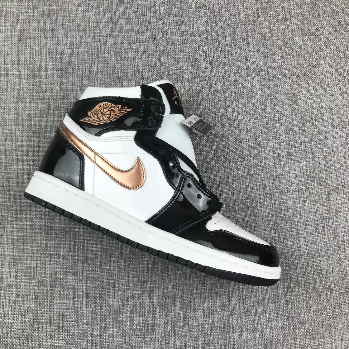 Air Jordan 1 Mid Sneakers in Black White Metallic Gold 852542-007 - product image from the listing.
