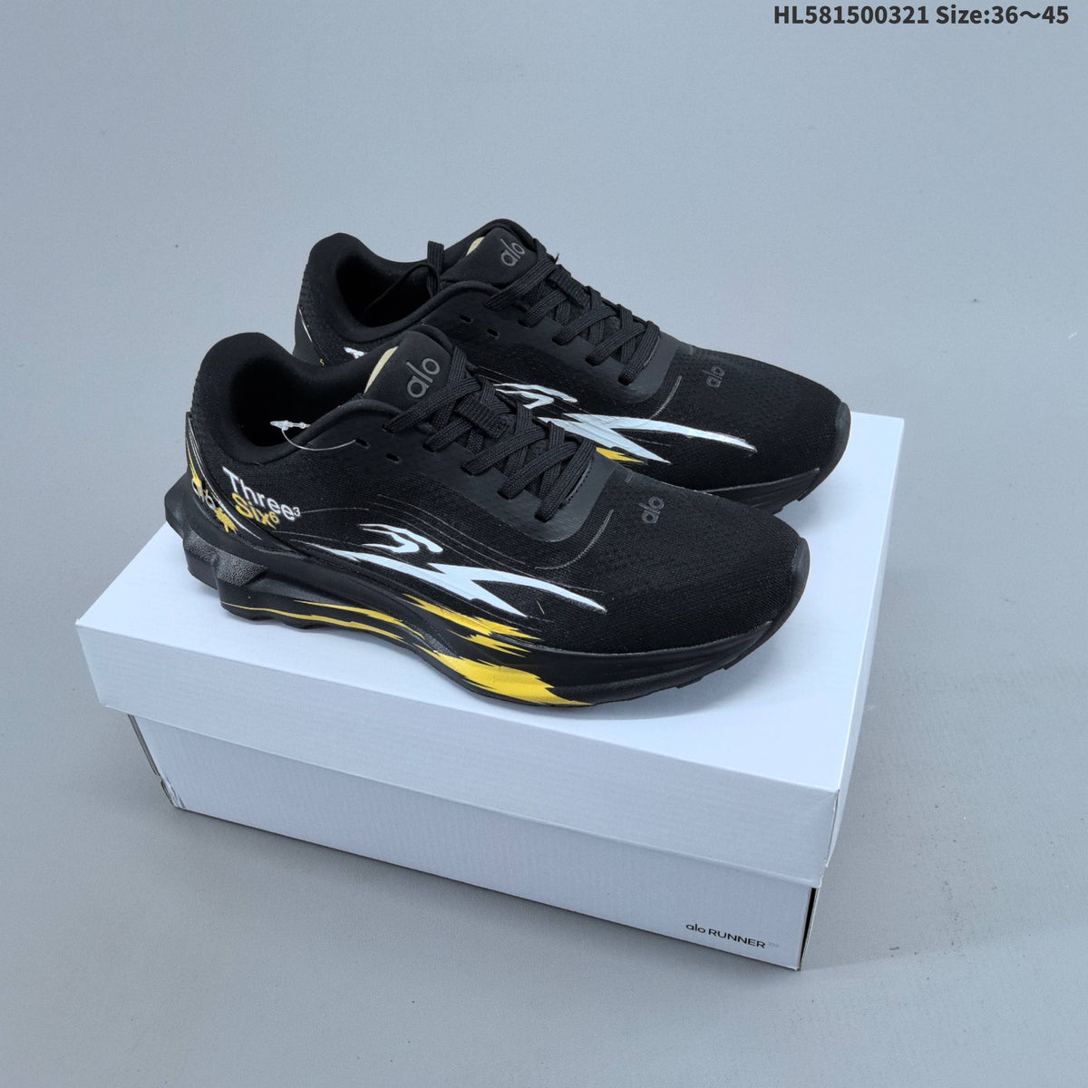 Alo Yoga Alo Runner Graphic Running Sneakers, in Black - product image from the listing.