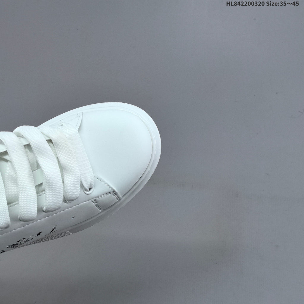 Alexander McQueen Oversized Low-Top Sneakers, in White and Black - product image from the listing.