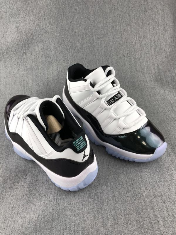 White and Black Jordan 11 Low Sneakers - product image from the listing.