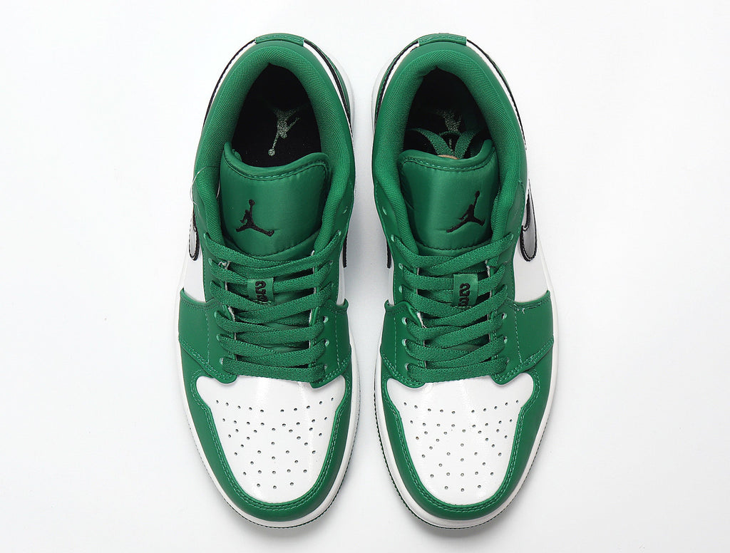 Jordan 1 Low Sneakers in White and Green 553558-301 - product image from the listing.