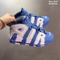 Blue and White Nike Air More Uptempo Sneakers - product image from the listing.
