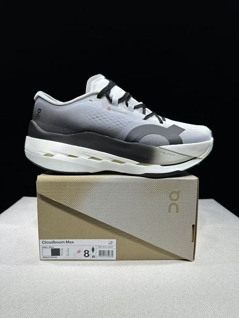 On Cloudboom Max Running Shoes, in White and Black - product image from the listing.