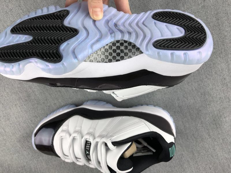 White and Black Jordan 11 Low Sneakers - product image from the listing.