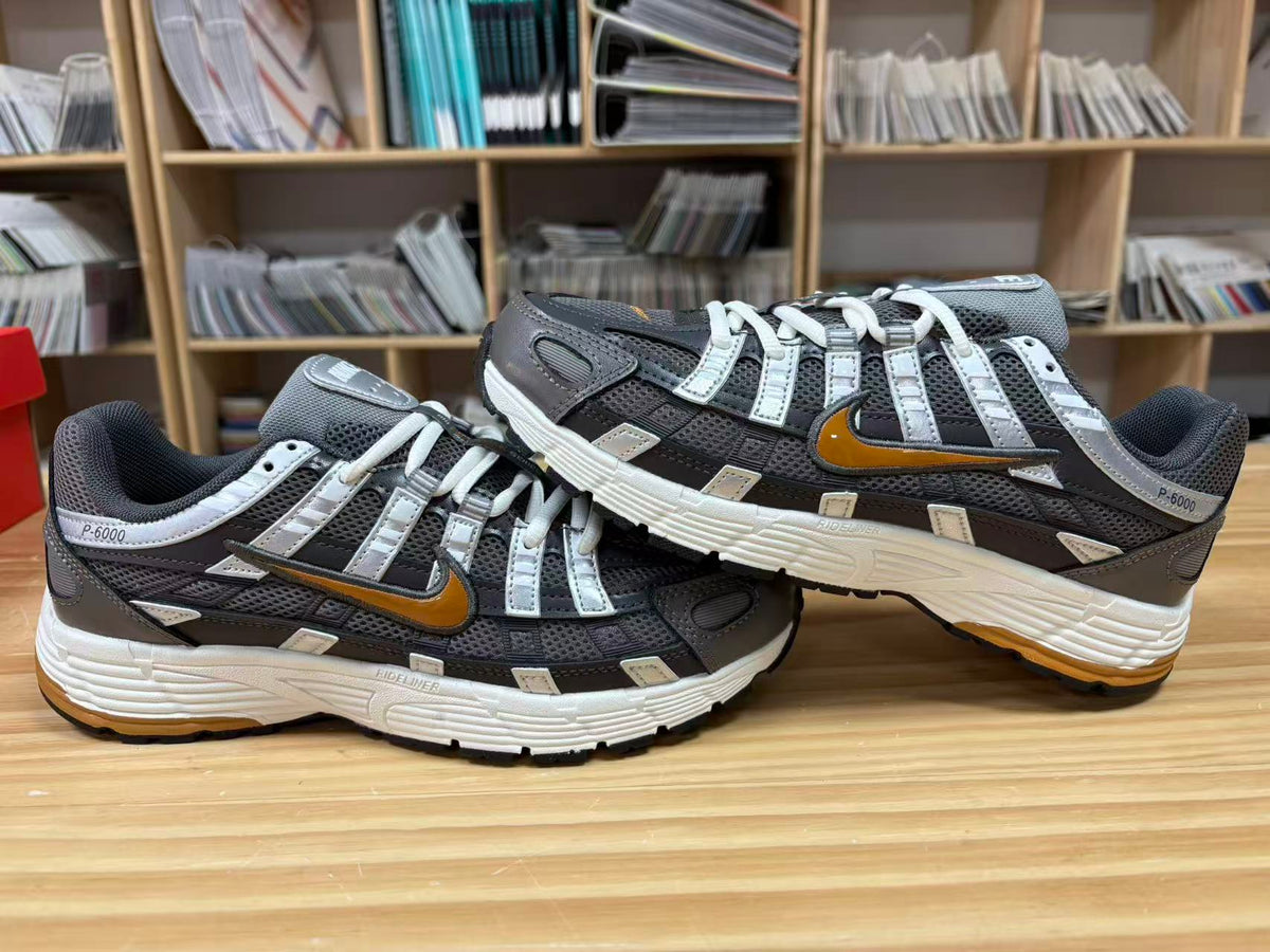 Nike P-6000 Sneakers CD6404-204 in Charcoal and White - product image from the listing.