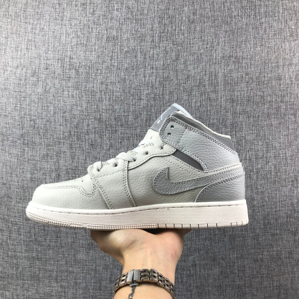 White and Grey Air Jordan 1 Mid Sneakers - product image from the listing.