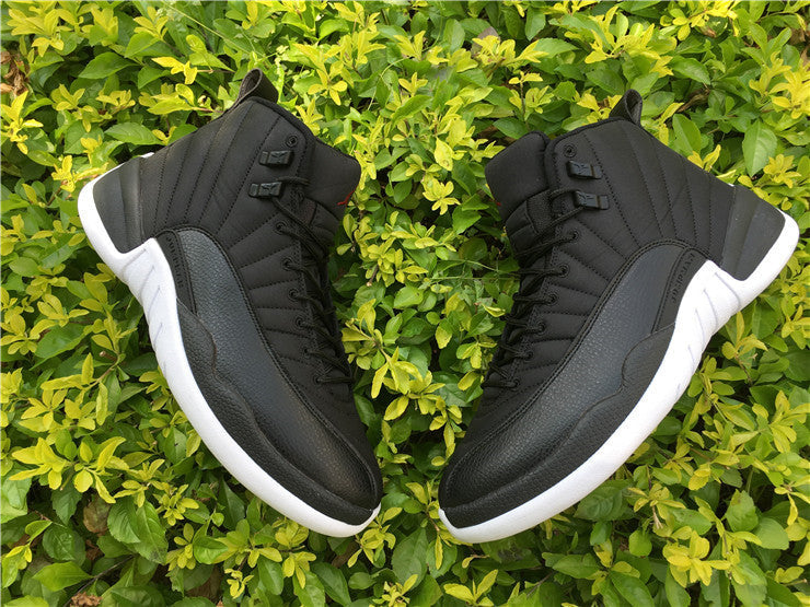 Air Jordan 12 Black Nylon High-Top Sneakers - product image from the listing.